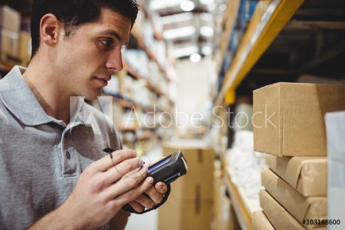 Warehouse worker scanning box
