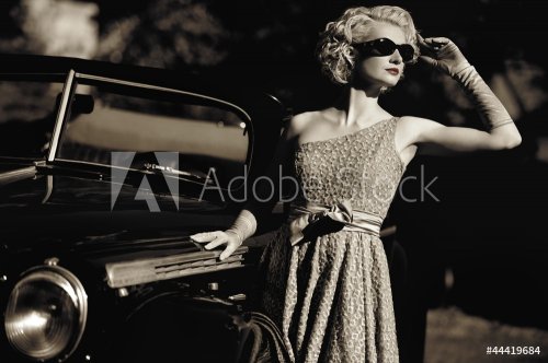 Woman near a retro car outdoors - 901137965