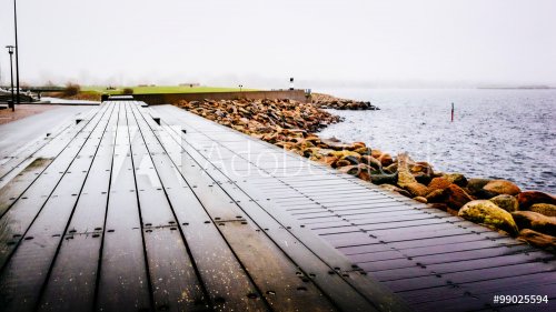 Wooden docks by the sea in Malmo in Sweden on a cloudy day - 901148229