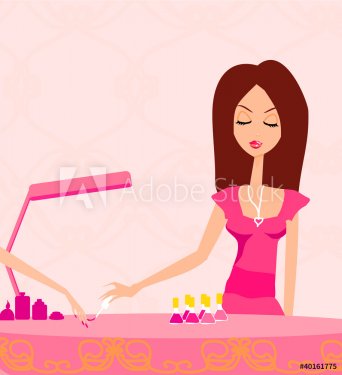 Young lady doing manicure in beauty salon - 900469368