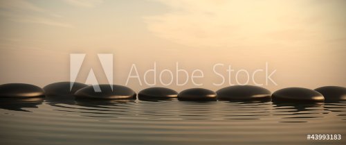 Zen stones in water on sunrise - 901145281