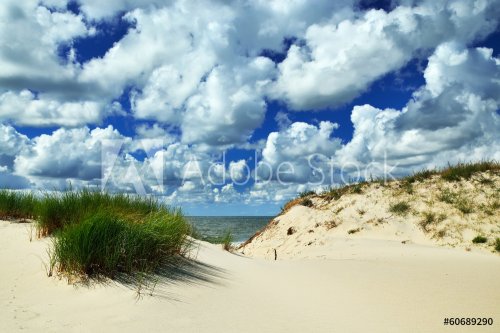 Beautiful Baltic dunes and dramatic Cumulus clouds