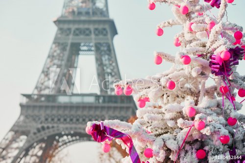 Christmas tree covered with snow near the Eiffel tower in Paris - 901154006