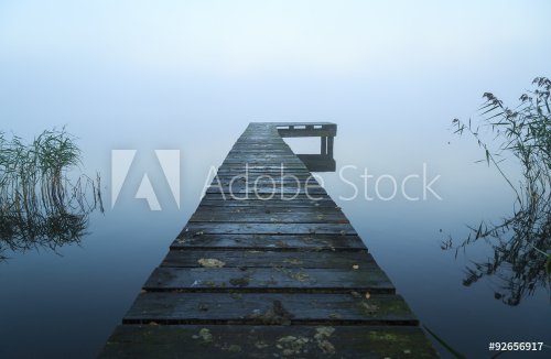 Close up of old, wooden jetty in the autumn fog. - 901149340