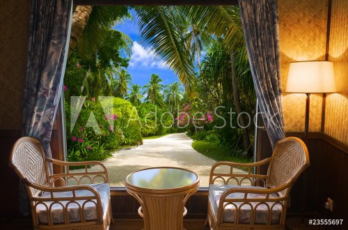 Hotel room and tropical landscape - 901145571