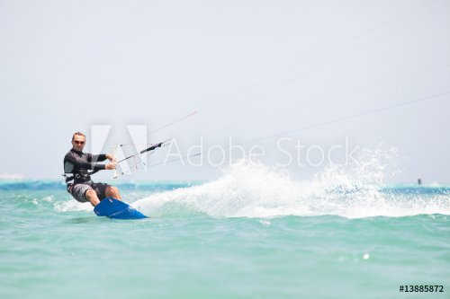 Kiteboarder surfing - 900455750