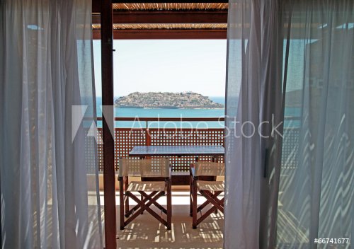 Open balkony with furniture and sea view(Crete, Greece). - 901145563