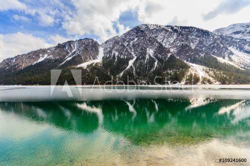 Plansee lake frozen on the end of winter, Tyrol, Austria.
