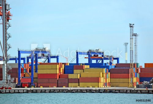 Port cargo crane and container over blue sky background - 901145596