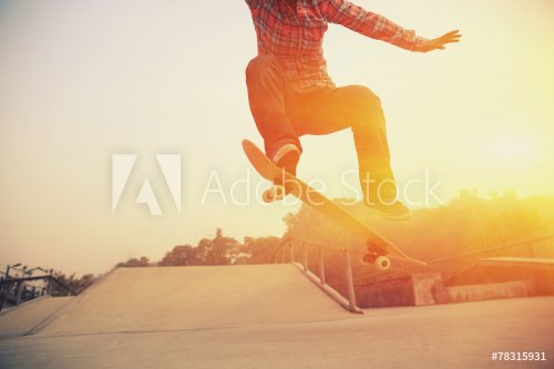 skateboarding legs  jumping at skatepark - 901144412