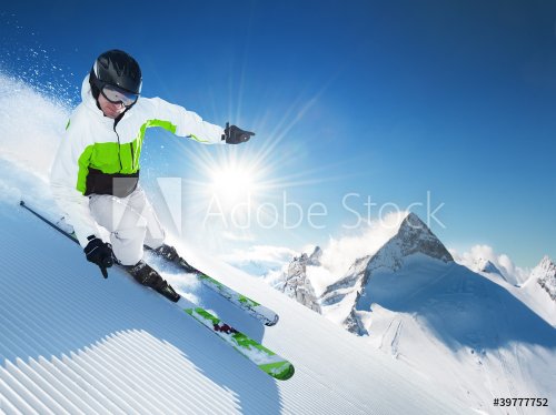Skier in high mountains at sunny day - 900439076