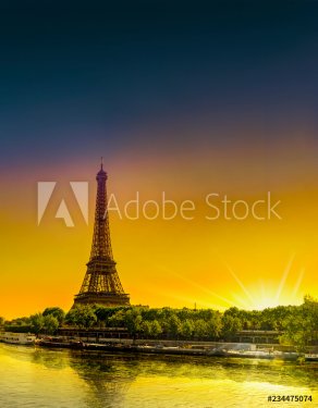 Sunrise at the Eiffel towerand Seine river in spring in Paris, France. Vertical view from Bir Hakeim bridge
