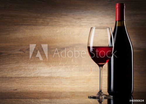 Wine glass and Bottle on a wooden background - 900425172