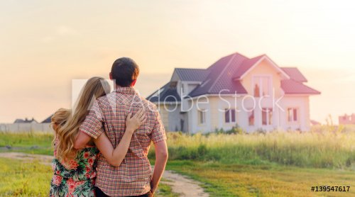 Young Couple Standing Outside Dream Home - 901152705