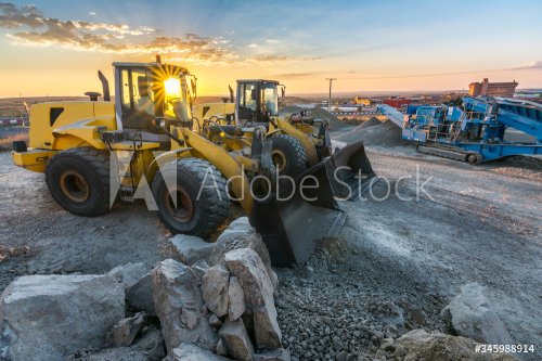 Group of excavators at a construction site - 901156354