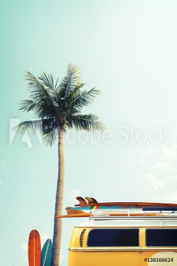 Vintage car parked on the tropical beach (seaside) with a surfboard on the ro... - 901157222