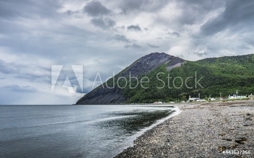 View on a cloudy on the cliffs, the beach, the St Lawrence river in Mont Saint Pierre, a small village on the northern shore of the Gaspesie peninsula in Quebec (Canada)