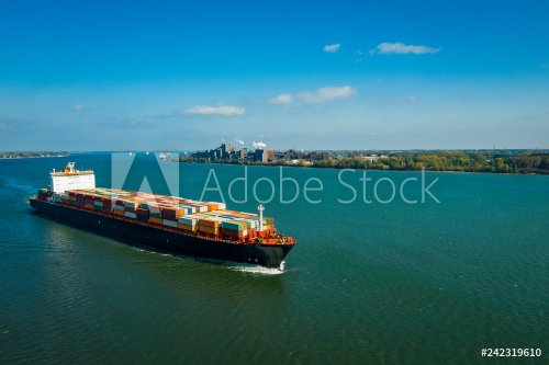 Aerial view of a container ship going upstream in the St. Lawrence River near... - 901157346