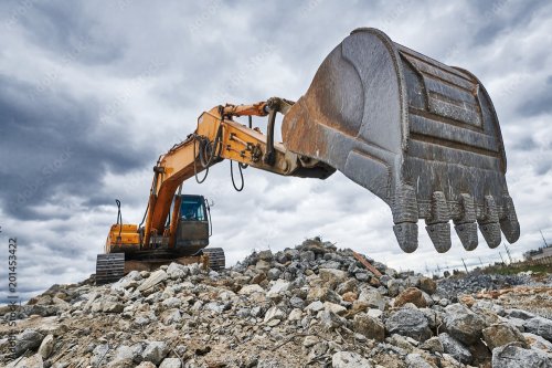 Excavator loader machine at demolition construction site