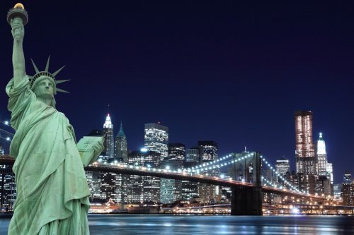 The Statue of Liberty and Manhattan skyline at Night - 900023854