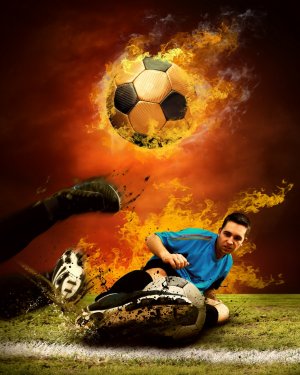 Football player in fires flame on the outdoors field