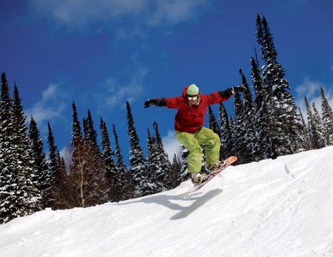 Snowboarder jumping - 900076419
