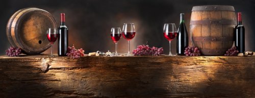 still life with red wine with barrel on old wood - 900087509