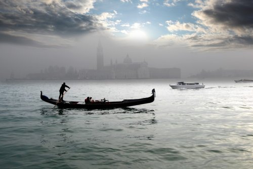 Venice with gondola on canal in Italy - 900133279
