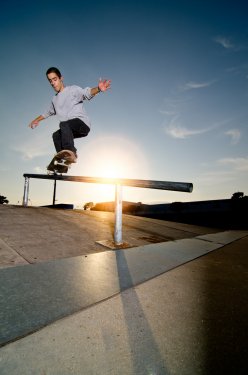 Skateboarder on a grind - 900207769