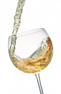 White wine splashing in a glass