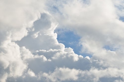 classic cloudscape. Blue sky with ornamental clouds - 900359924