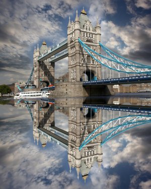 Famous Tower Bridge with boat in  London, UK