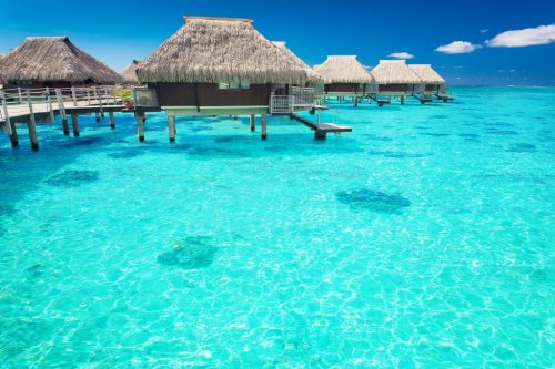 Water villas in the ocean with steps into lagoon