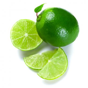 Sliced limes over white background
