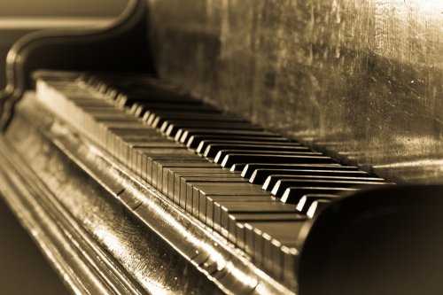 Antique piano and sepia toned