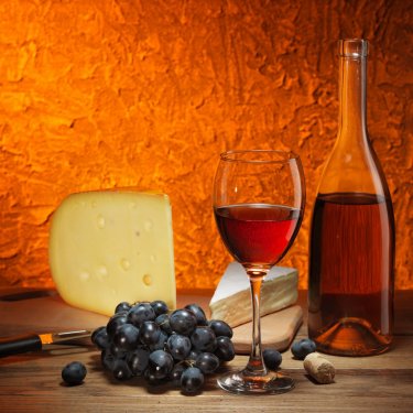 Still-life with cheese, grapes and glass of red wine. - 900634778