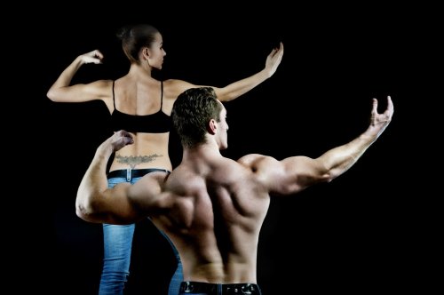 man and a woman in the gym - 900899641