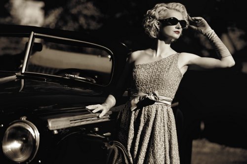 Woman near a retro car outdoors - 901137964