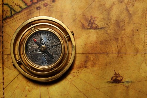 Vintage compass on the old map - 901138019