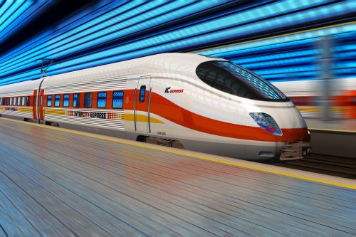 High speed train departs from railway station with motion blur