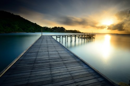 The wooden bridge with sunrise at national park...