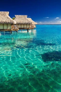 Water villas over tropical reef