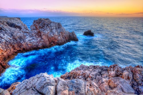 Menorca Punta Nati sunset in Balearic Islands - 901141389