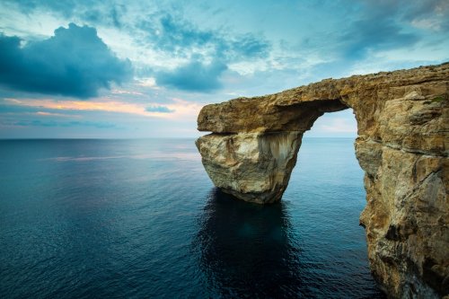 Azure Window, natural arch on Gozo island, with blue sky - 901142174
