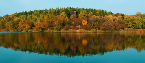 Autumn landscape with a reflection in the lake - 901143548