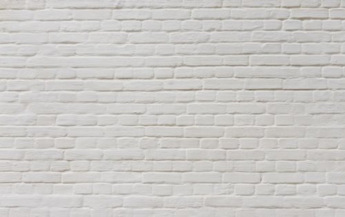 Background of  vintage brick wall covered with white plaster