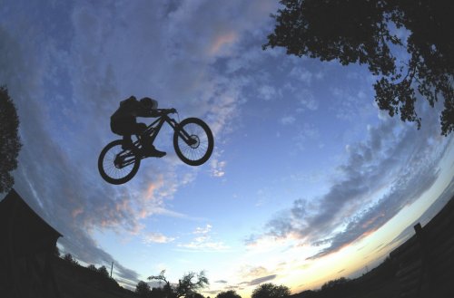 Silhouette of a radical mountain bike jump