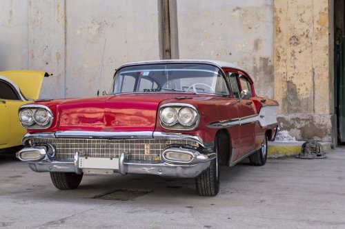 Classic american red car in Havana, Cuba - 901145079