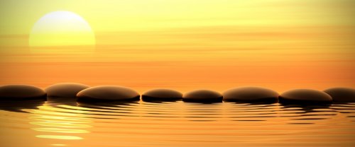 Zen stones in water on sunset - 901145279
