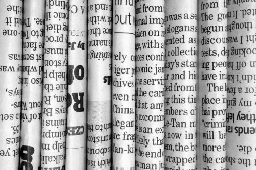 Row of Newspapers in black and white